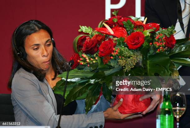 Brazil's Marta looks surprised after receiving some flowers ahead of the Women's World Player of the Year Award