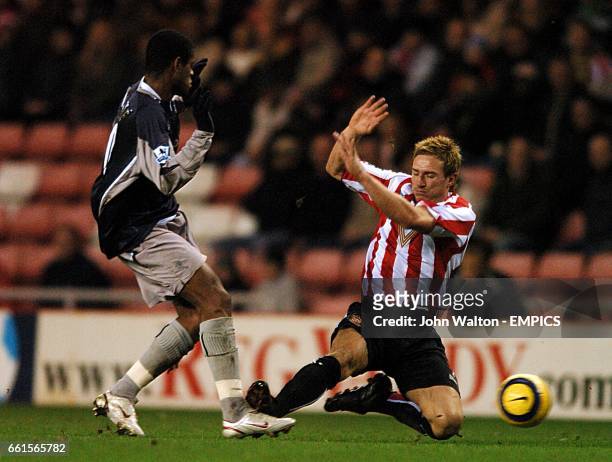 Sunderland's Liam Lawrence slides in to tackle Bolton Wanderers' Ricardo Vaz Te