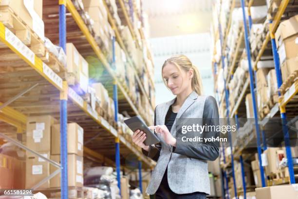 ensuring deliveries in warehouse - high up stock pictures, royalty-free photos & images