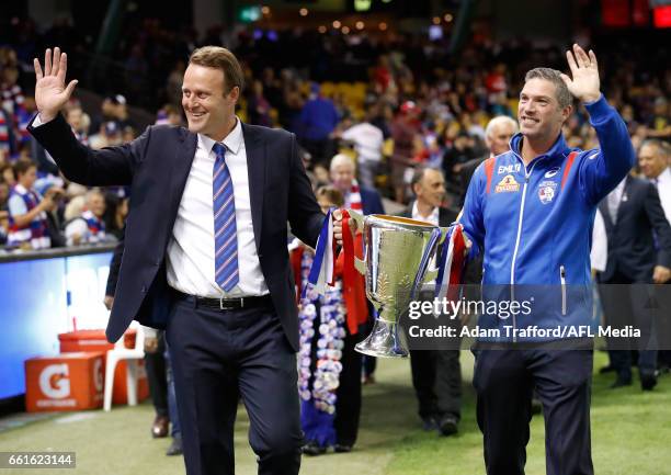 Bulldogs legends Chris Grant and Rohan Smith carry the 2016 Premiership Cup during the 2017 AFL round 02 match between the Western Bulldogs and the...