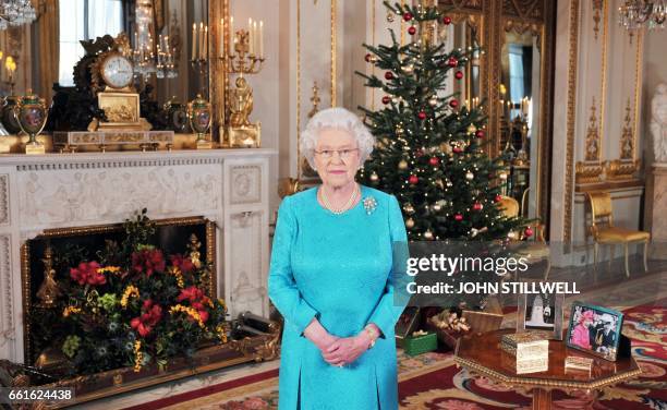Picture dated on December 10, 2009 shows Queen Elizabeth II posing prior to the recording of her Christmas Day broadcast to the Commonwealth, in the...