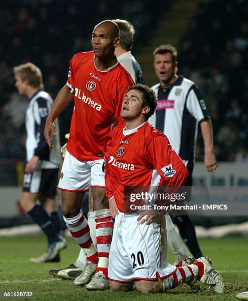 Charlton Athletic's Bryan Hughes rues missing a chance on goal against West Bromwich Albion as Marcus Bent looks on