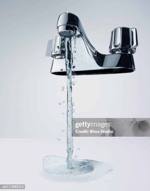 water running from faucet - faucet stock pictures, royalty-free photos & images