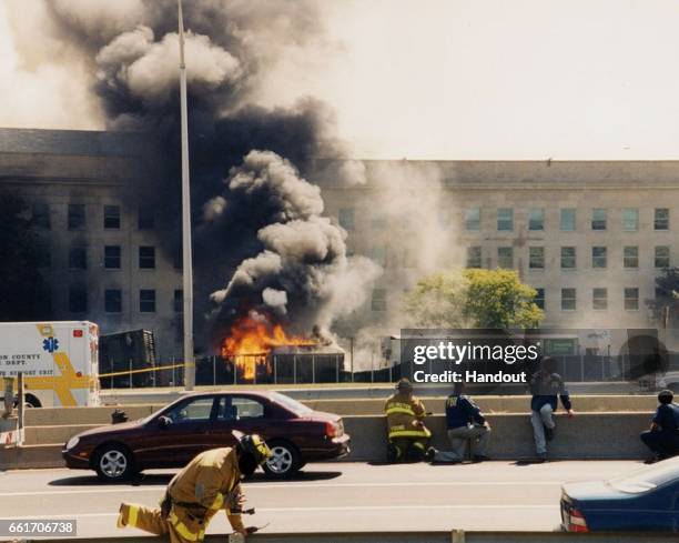 In this handout provided by the Federal Bureau of Investigation , first responders on scene following an attack at the Pentagon on September 11, 2001...