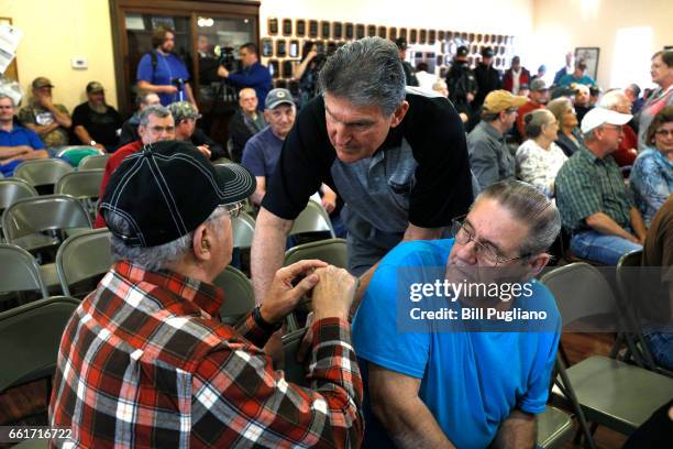 Senator Joe Manchin shakes hands with constituents before holding a Town Hall meeting with coal miners on March 31, 2017 in Matewan, West Virginia....