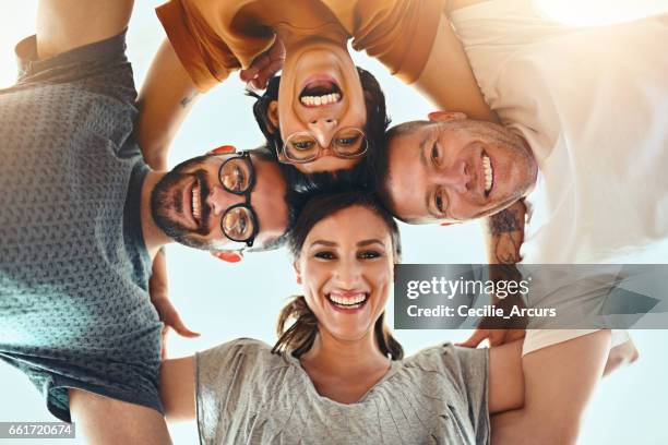 we design together - huddling stock pictures, royalty-free photos & images