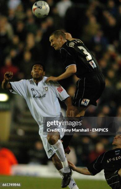 Milton Keynes Don's Clive Platt and Brentford's Andrew Frampton