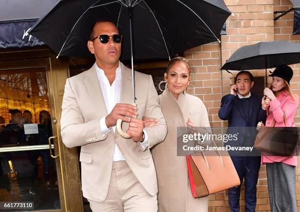 Alex Rodriguez and Jennifer Lopez leave Marea restaurant on March 31, 2017 in New York City.
