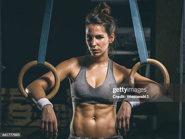female athlete, gymnastic rings - women with 6 pack abs stock pictures, royalty-free photos & images