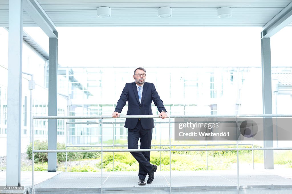 Businessman outside office building