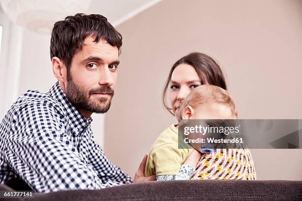 parents with sick toddler at home - couple serious bildbanksfoton och bilder