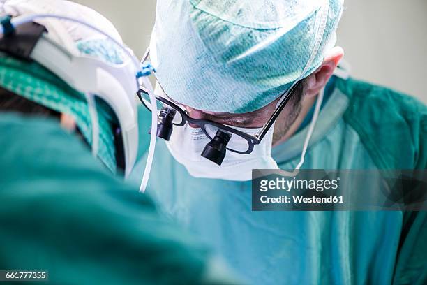 surgeons during an operation - heart surgery stock pictures, royalty-free photos & images