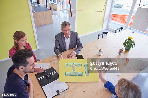 business people having a meeting in board room - employee engagement logo stock pictures, royalty-free photos & images