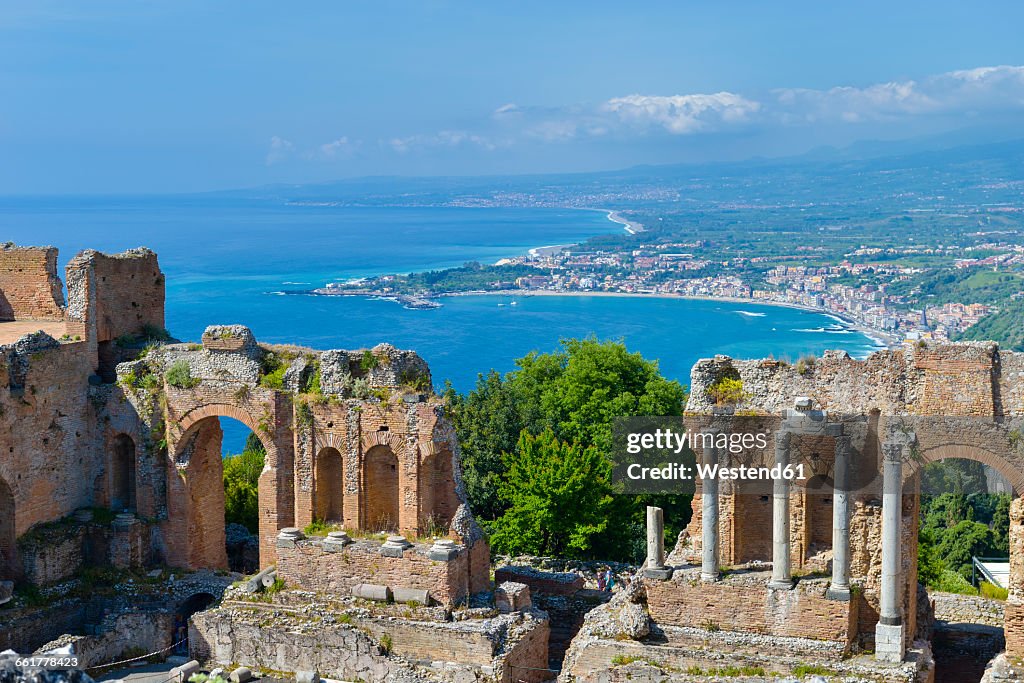 Italy, Sicily, Taormina, Teatro Greco with Giardini Naxos in background