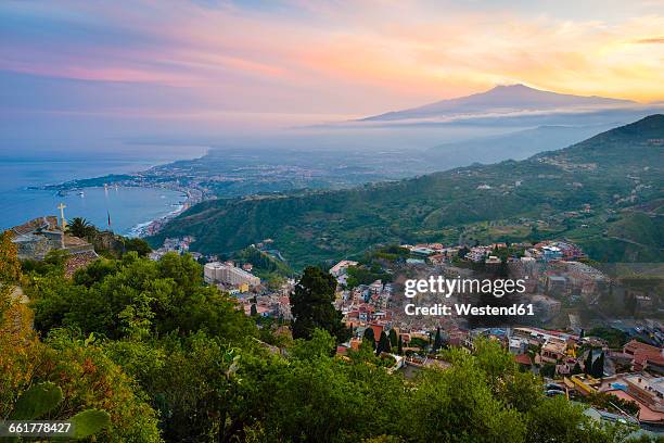 italy, sicily, taormina with mount etna at sunset - etna stock pictures, royalty-free photos & images