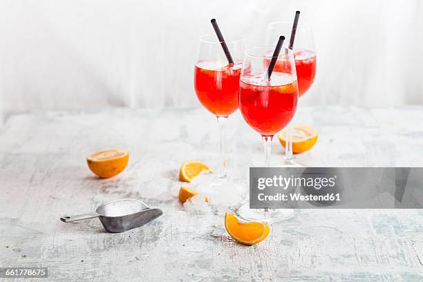 spritz, bitter liqueur, prosecco wine, sparkling mineral water and orange slice - spritz drink stock pictures, royalty-free photos & images