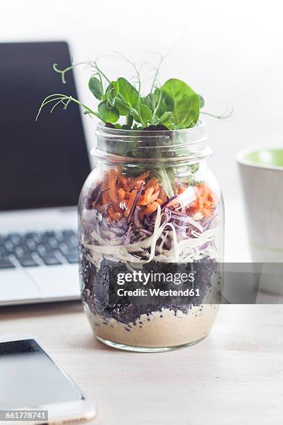 rainbow salad in jar, smartphone, mug of coffee and laptop - tahini stock pictures, royalty-free photos & images