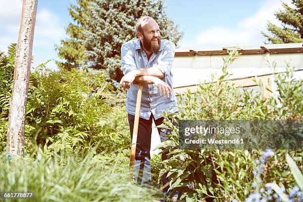 young man working garden - excavation stock-fotos und bilder