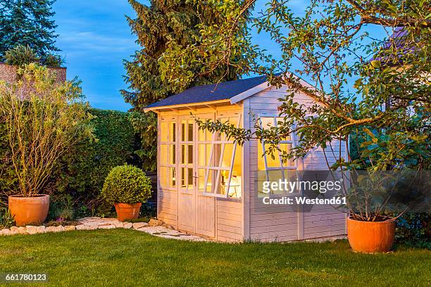 lighted garden shed - shed stock pictures, royalty-free photos & images