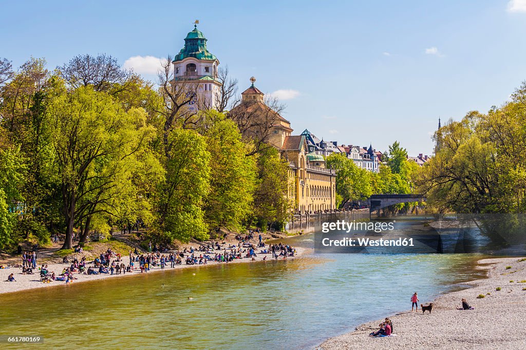 Germany, Munich, view to Mullersches Volksbad and people on the beach