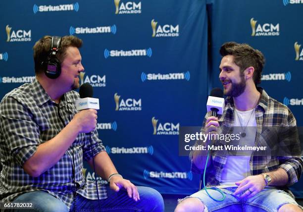 SiriusXM host Storme Warren and singer-songwriter Thomas Rhett attend SiriusXM's The Highway Channel broadcasts backstage leading up to the American...