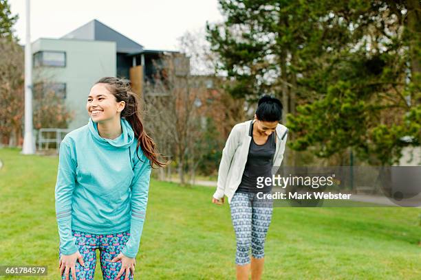 two young women outdoors, exercising - live at leeds 2016 stock pictures, royalty-free photos & images