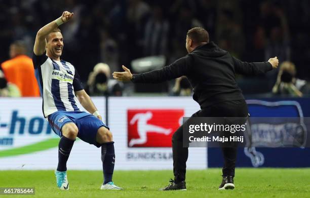 Peter Pekarik of Berlin celebrates his team's first goal with head coach Pal Dardai during the Bundesliga match between Hertha BSC and TSG 1899...