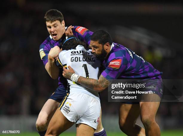 Leeds Rhinos's Ashton Golding is tackled by Wigan Warriors' Joel Tomkins and Frank-Paul Nu'uausala during the Betfred Super League Round 7 match...