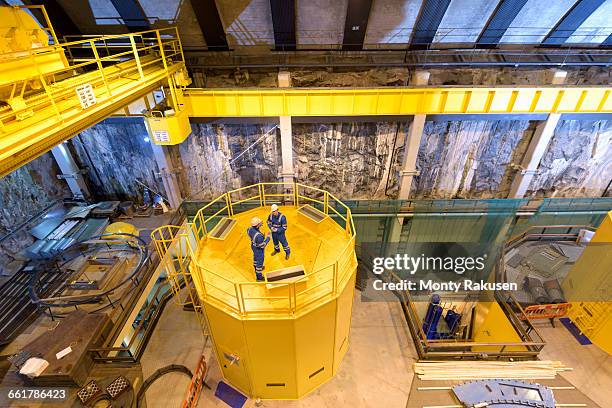 workers in generating hall in hydroelectric power station, high angle view - mid distance stock pictures, royalty-free photos & images