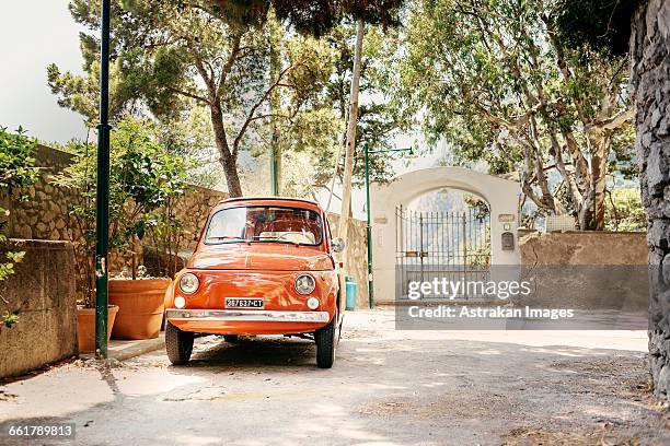 vintage car parked on street - vintage italian car stock pictures, royalty-free photos & images