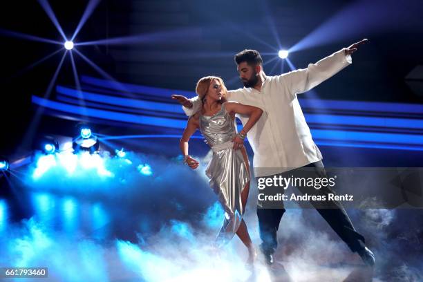 Faisal Kawusi and Oana Nechiti perform on stage during the 3rd show of the tenth season of the television competition 'Let's Dance' on March 31, 2017...