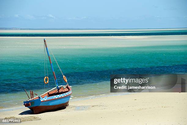 a dhow on the beach, inhambane, mozambique - mozambique beach stock pictures, royalty-free photos & images