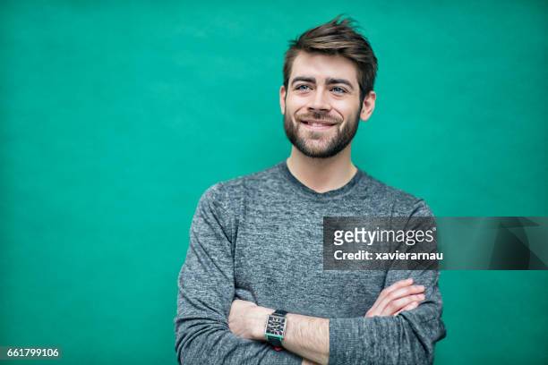 portrait of a young french man - green background stock pictures, royalty-free photos & images
