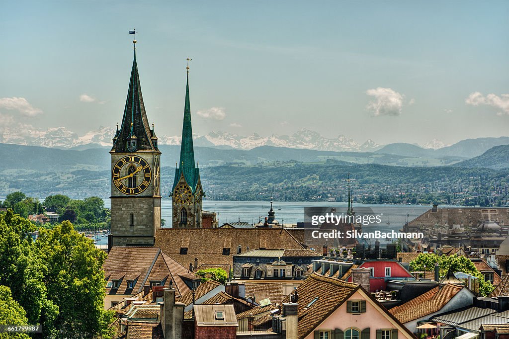 Fraumunster and St Peter church towers and clock face and city skyline, Zurich, Switzerland