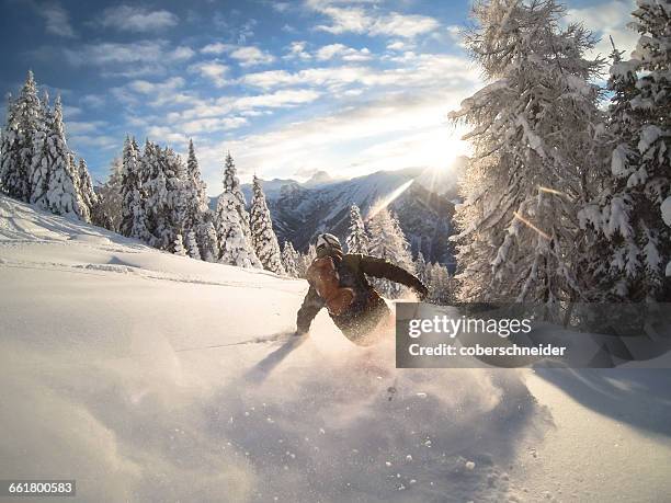 man powder skiing, alps, zauchensee, austria - winter sport fotografías e imágenes de stock