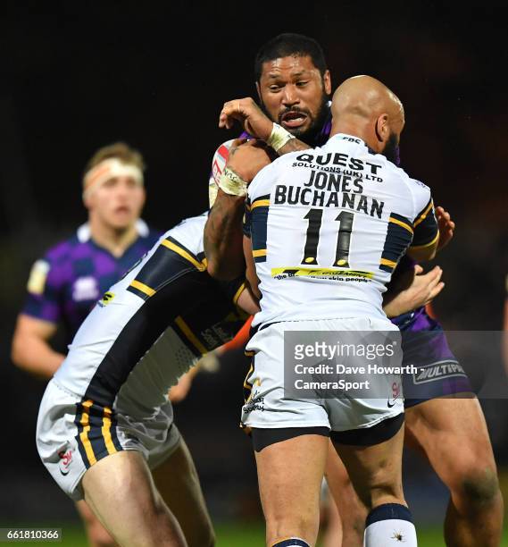 Wigan Warriors' Frank-Paul Nu'uausala is tackled by Leeds Rhinos's Jamie Jones during the Betfred Super League Round 7 match between Leeds Rhinos and...