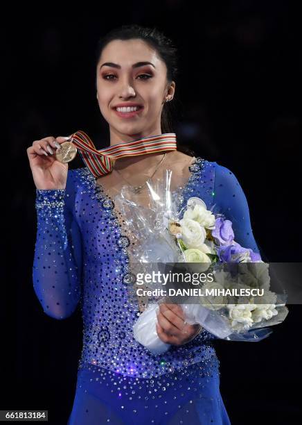 Bronze medallist Canada's Gabrielle Daleman poses with her medal on the podium after the woman's Free Skating event at the ISU World Figure Skating...
