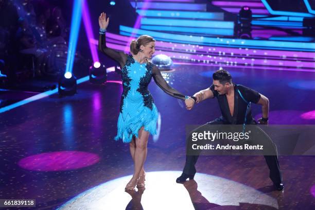 Anni Friesinger-Postma and Erich Klann perform on stage during the 3rd show of the tenth season of the television competition 'Let's Dance' on March...
