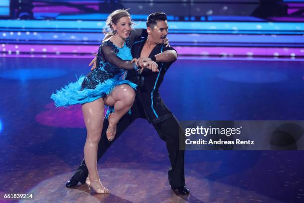 Anni Friesinger-Postma and Erich Klann perform on stage during the 3rd show of the tenth season of the television competition 'Let's Dance' on March...