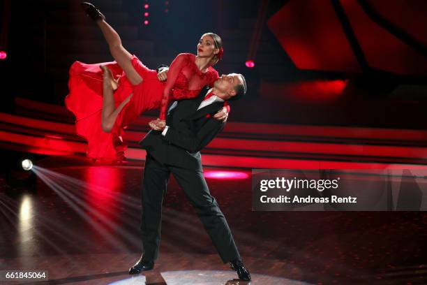 Ann-Kathrin Broemmel and Sergiu Luca perform on stage during the 3rd show of the tenth season of the television competition 'Let's Dance' on March...