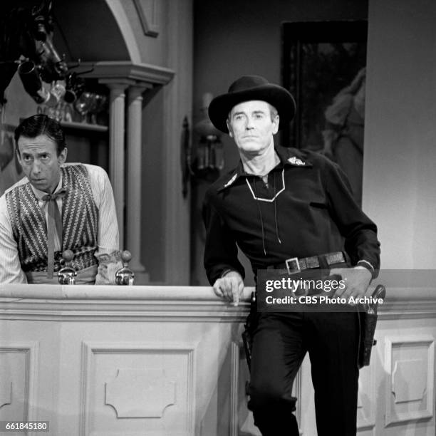 Guest star Henry Fonda performs a saloon sketch in western costume for the CBS television variety program, "The George Gobel Show". Also pictured:...