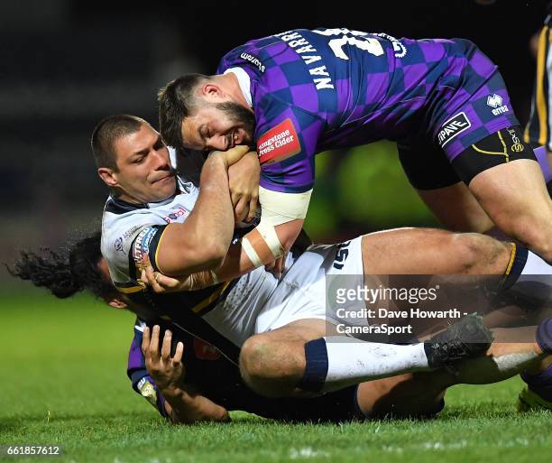 Leeds Rhinos's Ryan Hall is tackled by Wigan Warriors' Romain Navarrete during the Betfred Super League Round 7 match between Leeds Rhinos and Wigan...