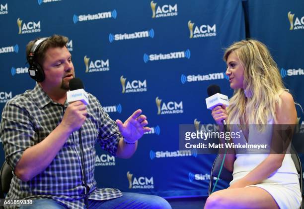 SiriusXM host Storme Warren and singer Kelsea Ballerini speak during SiriusXM's The Highway Channel broadcasts leading up to the ACM Awards at...