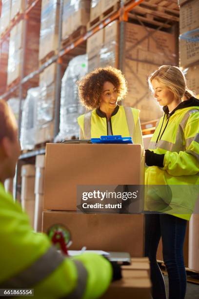 warehouse manager with her trainee - trainee teacher stock pictures, royalty-free photos & images