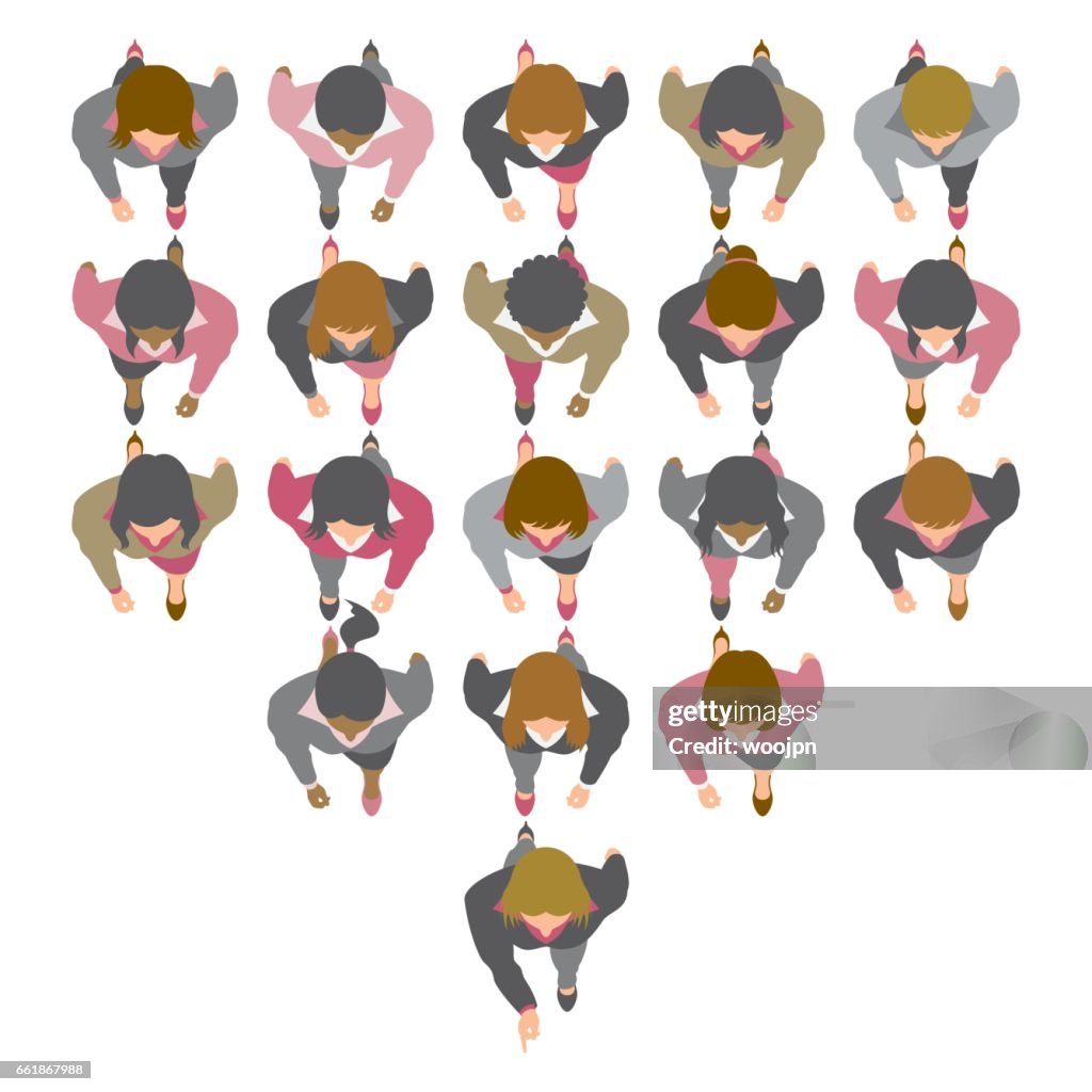 Female business team walking in same direction from above