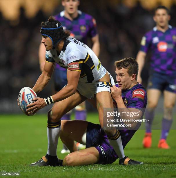 Leeds Rhinos's Ashton Golding is tackled by Wigan Warriors' Liam Forsyth during the Betfred Super League Round 7 match between Leeds Rhinos and Wigan...