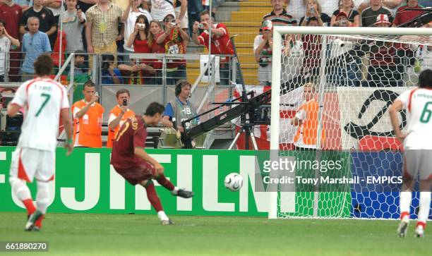 Portugal's Cristiano Ronaldo scores from the penalty spot