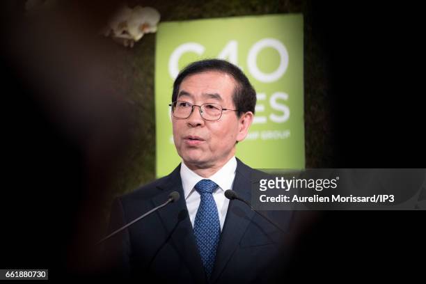 Mayor of Seoul, Park Won soon delivers a speech next to the Mayor of London, Sadiq Khan and Mayor of Paris and Head of C40 , Anne Hidalgo at the City...