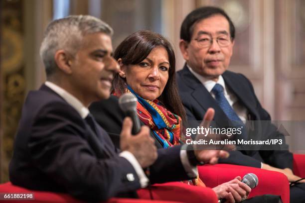 Mayor of London, Sadiq Khan delivers a speech next to the Mayor of Paris and Head of C40 , Anne Hidalgo and Mayor of Seoul, Park Won soon at the City...