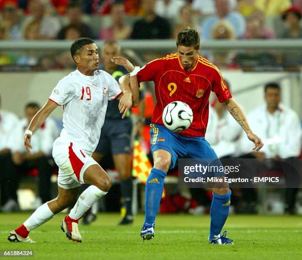 Anis Ayari, Tunisia and Fernando Torres, Spain battle for the ball